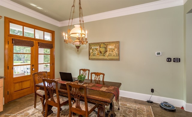 dining space with crown molding, french doors, and a notable chandelier