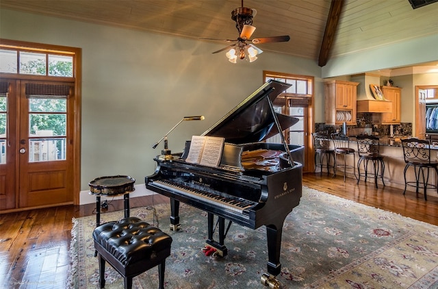 miscellaneous room with ceiling fan, wood ceiling, dark hardwood / wood-style flooring, high vaulted ceiling, and beam ceiling