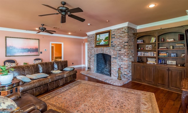 living room with ceiling fan, brick wall, dark hardwood / wood-style floors, a fireplace, and ornamental molding