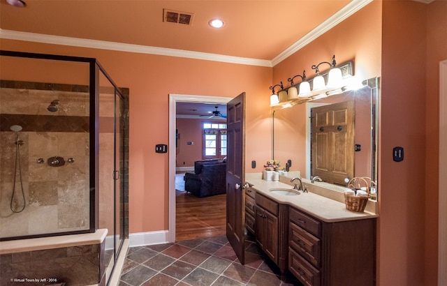 bathroom with tile flooring, an enclosed shower, ceiling fan, vanity, and ornamental molding