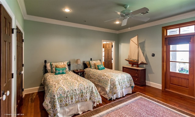 bedroom with dark hardwood / wood-style flooring, ceiling fan, and crown molding