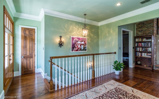 entryway with crown molding and dark hardwood / wood-style flooring