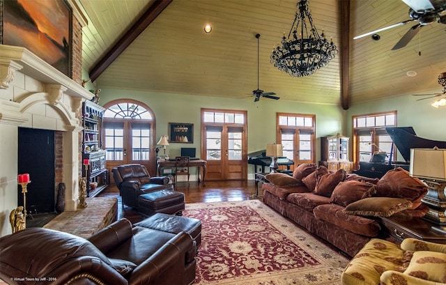 living room with dark hardwood / wood-style flooring, high vaulted ceiling, french doors, and plenty of natural light