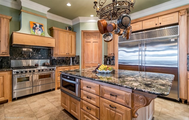 kitchen featuring backsplash, light tile floors, a center island, custom range hood, and high quality appliances