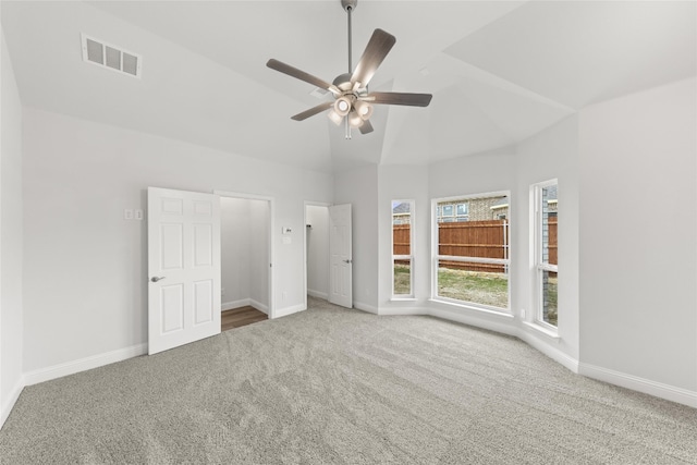 unfurnished bedroom with light carpet, high vaulted ceiling, and ceiling fan