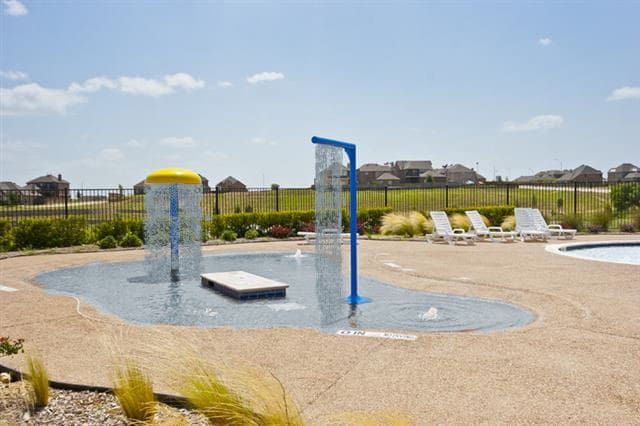 view of property's community featuring a pool