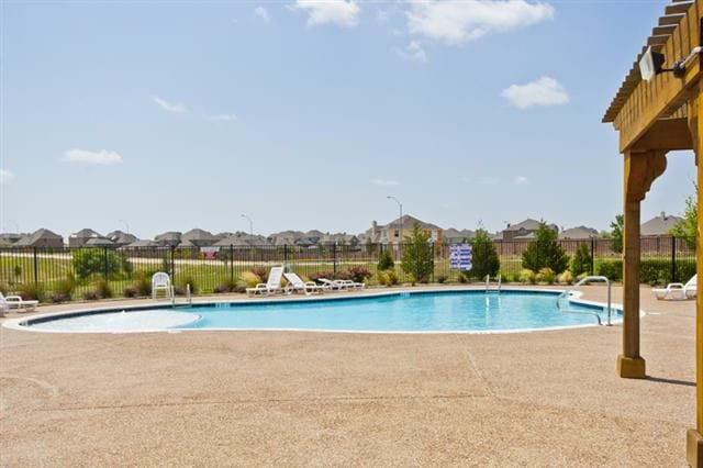 view of swimming pool with a patio