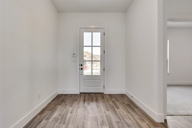 doorway to outside with light hardwood / wood-style floors