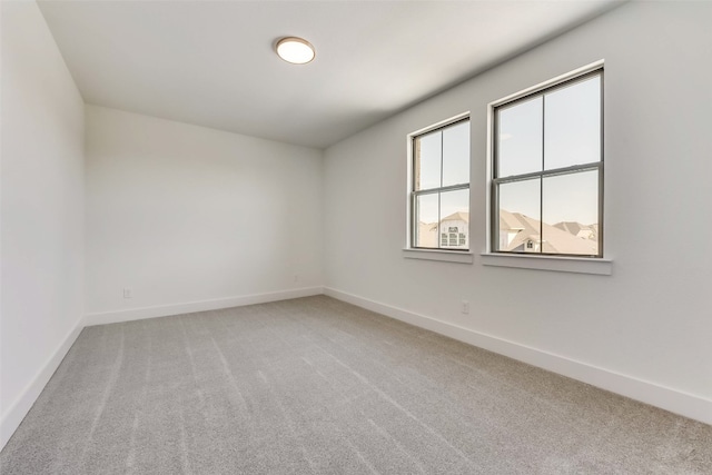 unfurnished room featuring carpet