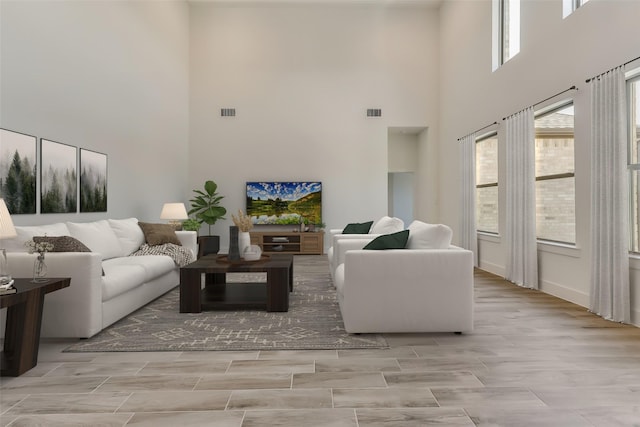 living room with a high ceiling