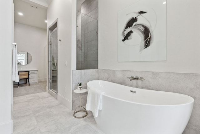 bathroom with tile walls, tile flooring, and independent shower and bath