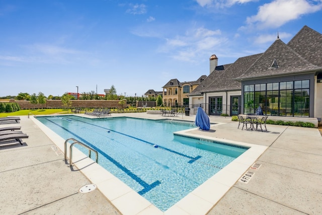 view of swimming pool featuring a patio