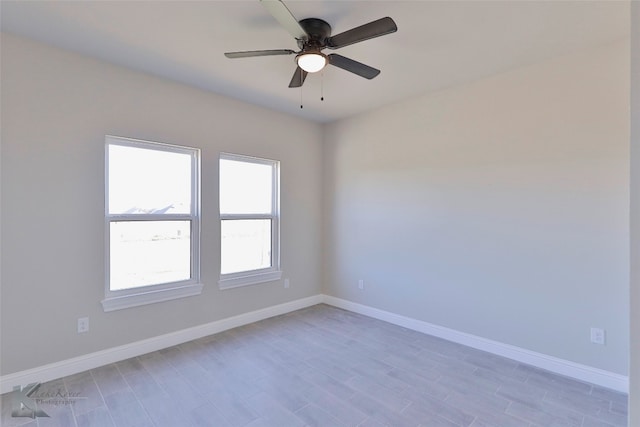 empty room featuring ceiling fan and light hardwood / wood-style flooring