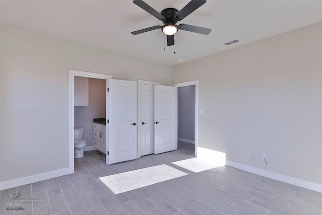 unfurnished bedroom featuring connected bathroom and ceiling fan