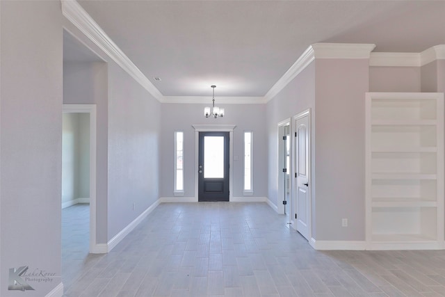 entrance foyer featuring a notable chandelier, crown molding, and light hardwood / wood-style floors