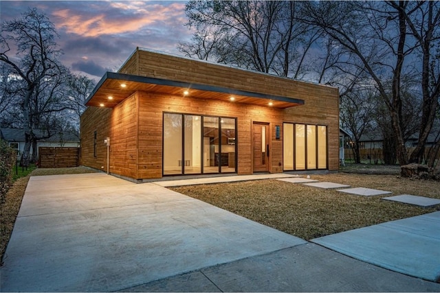 view of outdoor structure at dusk