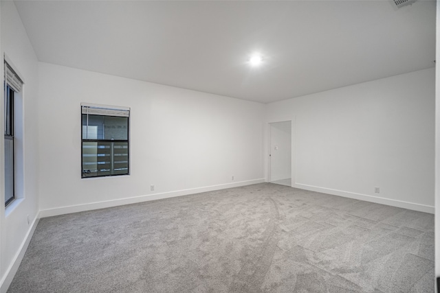 unfurnished room with light colored carpet