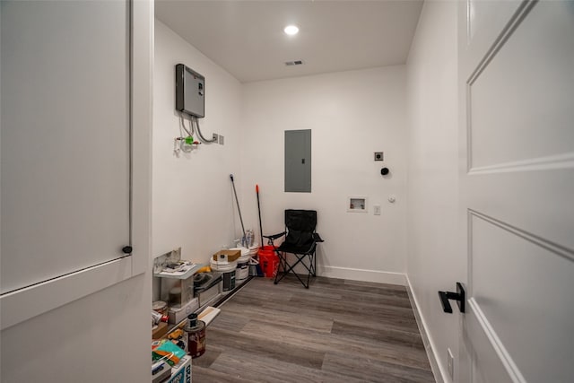 interior space with washer hookup, hookup for an electric dryer, and dark hardwood / wood-style floors