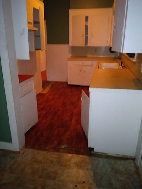 kitchen featuring sink and custom range hood