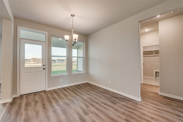 entryway with an inviting chandelier and hardwood / wood-style floors