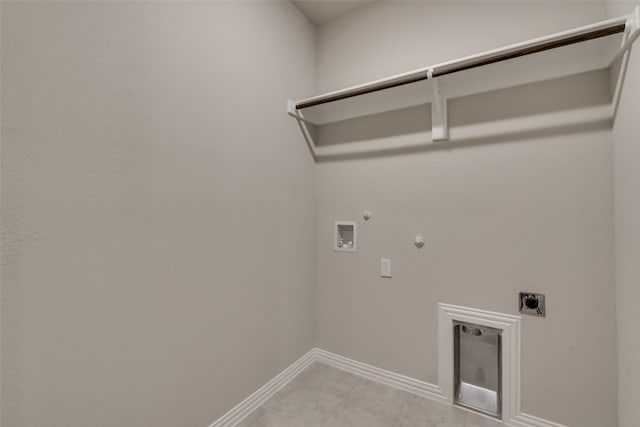 washroom featuring electric dryer hookup, hookup for a gas dryer, washer hookup, and light tile floors