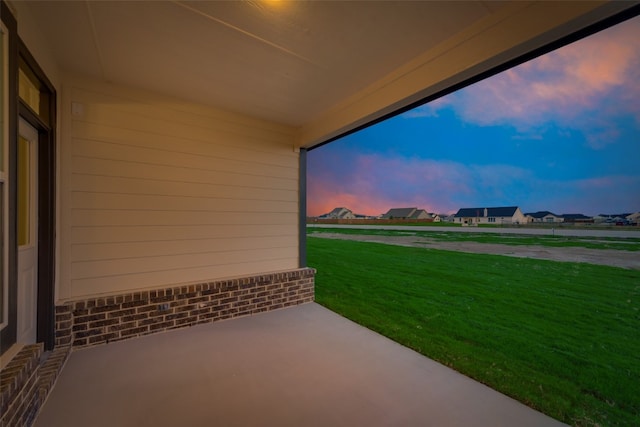 patio terrace at dusk with a yard