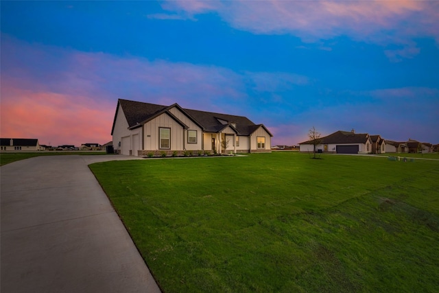 view of front of home with a yard