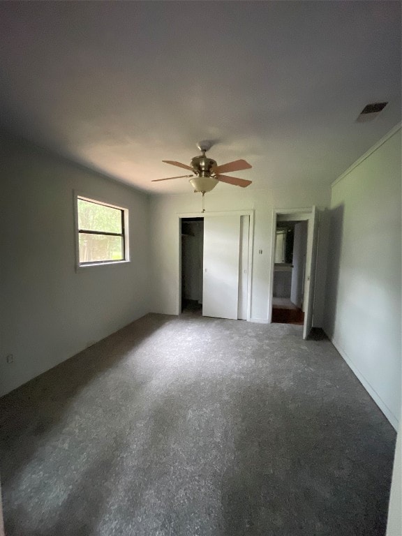 unfurnished bedroom featuring ceiling fan