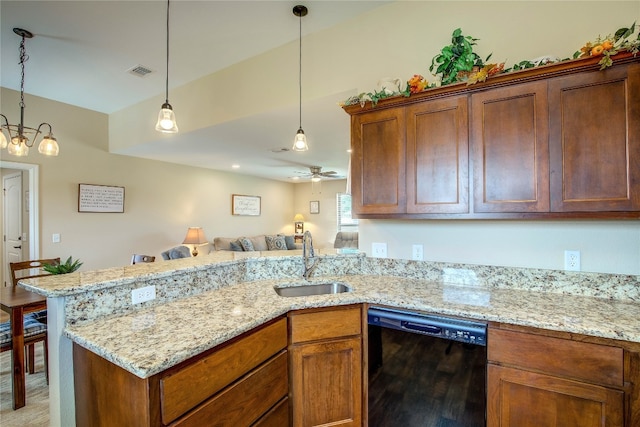 kitchen featuring decorative light fixtures, black dishwasher, ceiling fan with notable chandelier, light wood-type flooring, and sink