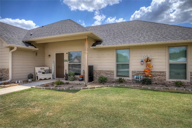 rear view of property with a lawn