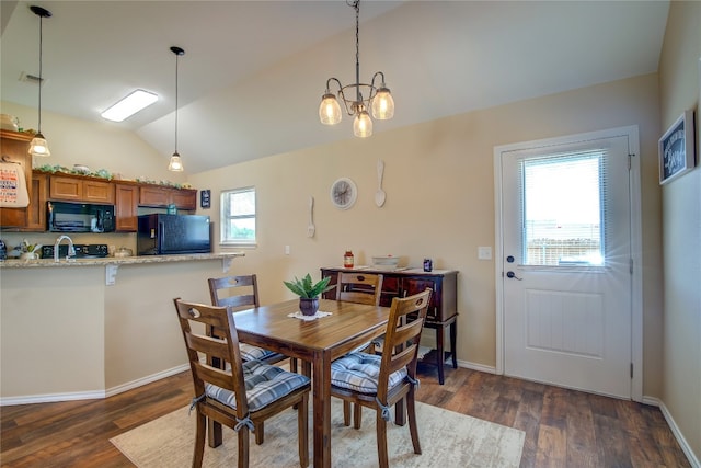 dining room featuring a chandelier, plenty of natural light, and dark wood-type flooring