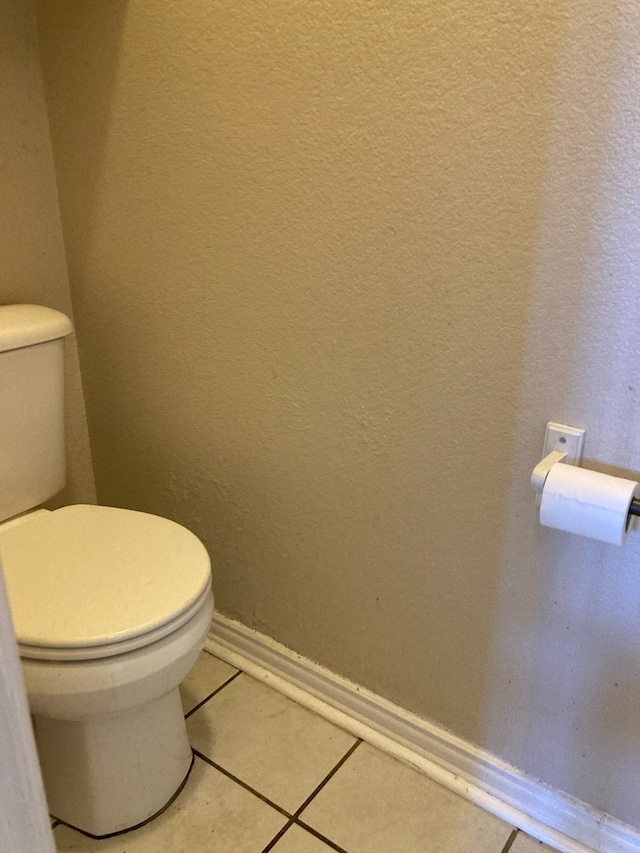 bathroom featuring tile patterned floors and toilet