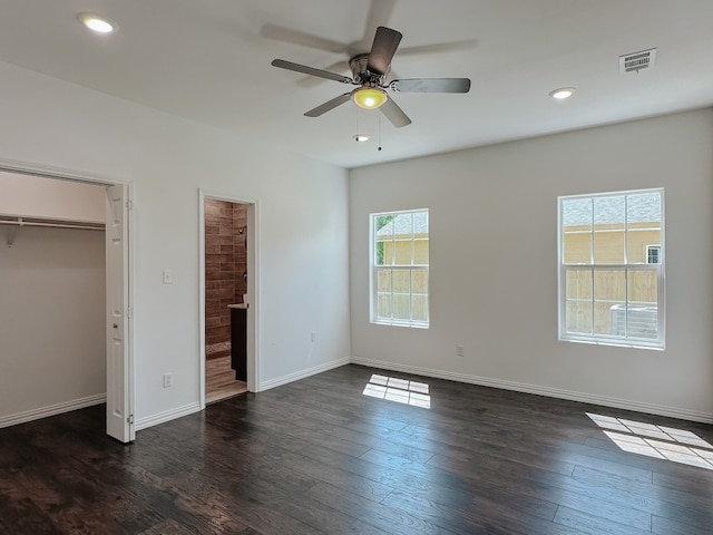 unfurnished bedroom featuring ceiling fan and dark hardwood / wood-style floors