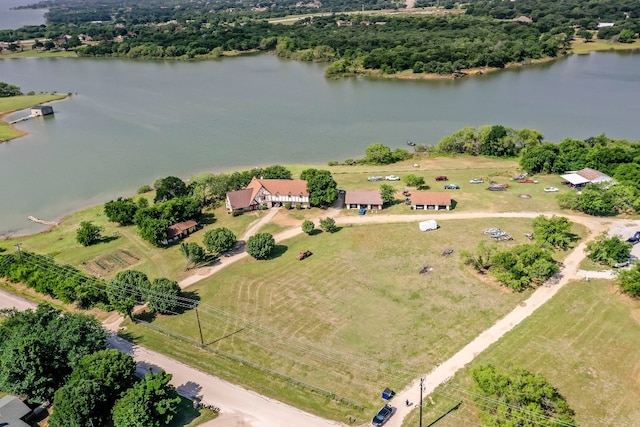 drone / aerial view featuring a water view and a rural view