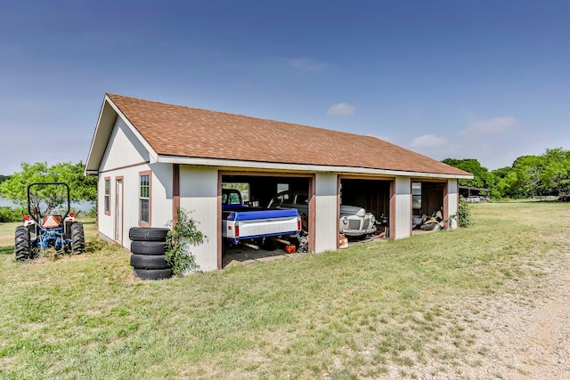 exterior space with a garage and a yard