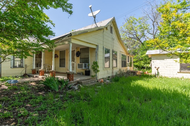 back of house with covered porch