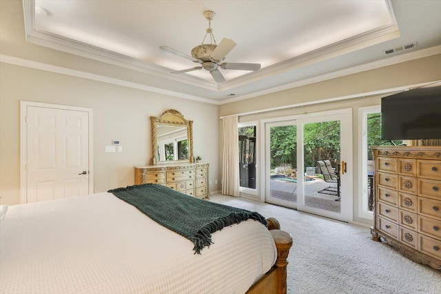 bedroom featuring carpet, crown molding, access to exterior, and a raised ceiling