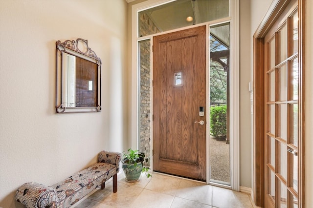 entryway featuring light tile patterned floors