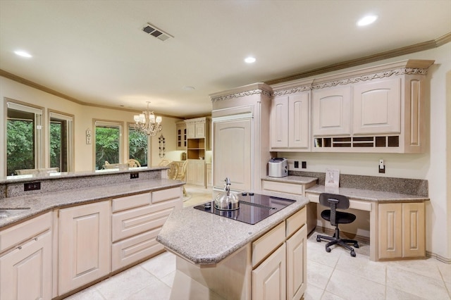 kitchen featuring light tile patterned floors, crown molding, a center island, and black electric cooktop