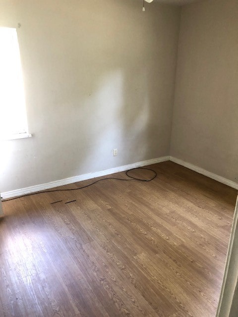 empty room featuring hardwood / wood-style floors