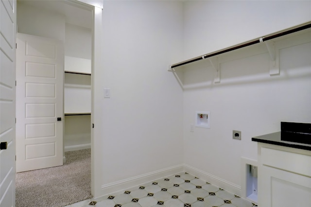 laundry room with light tile patterned flooring, hookup for an electric dryer, and washer hookup