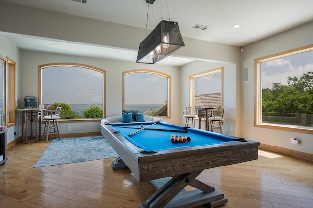 rec room with billiards and light hardwood / wood-style floors