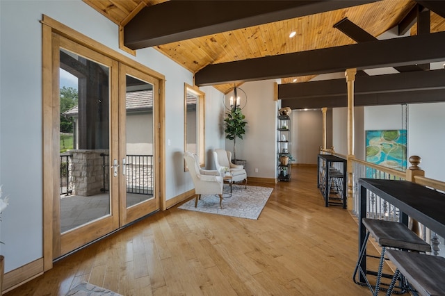 entryway with vaulted ceiling with beams, french doors, wooden ceiling, and light hardwood / wood-style flooring