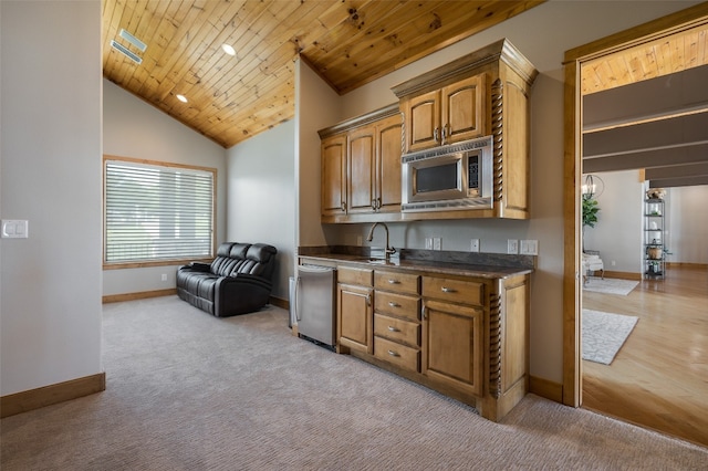 kitchen with appliances with stainless steel finishes, high vaulted ceiling, sink, light carpet, and wooden ceiling