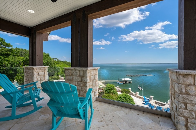 view of patio featuring a water view