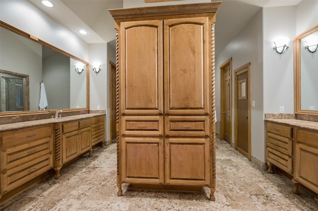 bathroom featuring tile floors and vanity