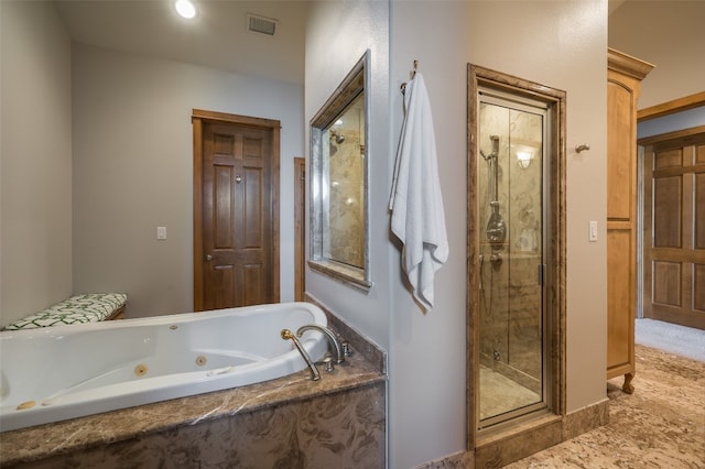 bathroom featuring tile flooring and independent shower and bath