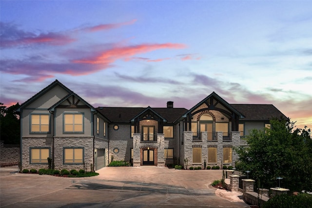 view of front of house with a balcony and a garage