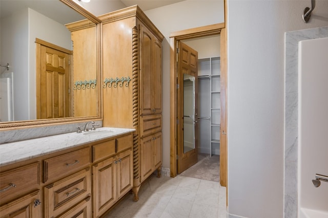 bathroom featuring tile floors and large vanity