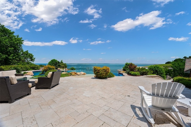 view of terrace with a water view and an outdoor hangout area